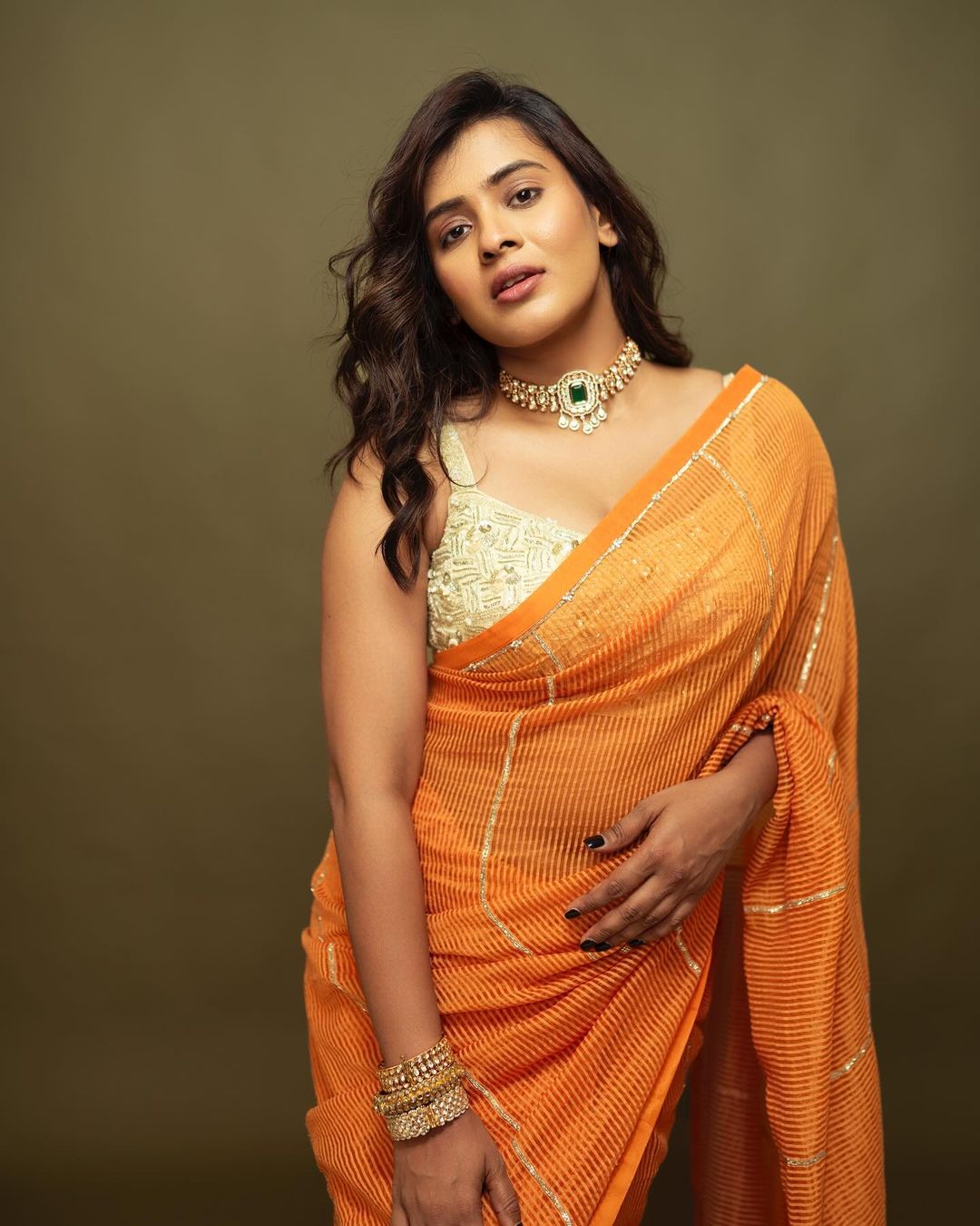 Indian Actress Hebah Patel Stills in Orange Saree